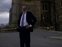Attorney Gene C. Colman outside the Parliament Bldg, Ottawa