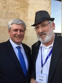 Attorney Gene C. Colman and former Canada PM Harper exchange some words about Bill C-560